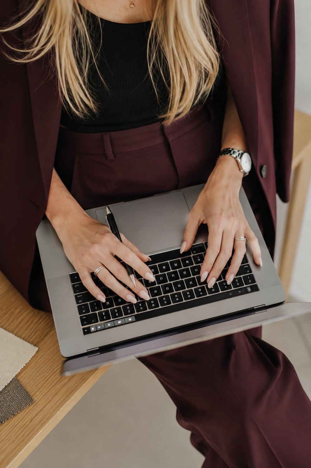 Sabrina of Salt and Sage Studios working at a laptop, web design and local SEO in Denver