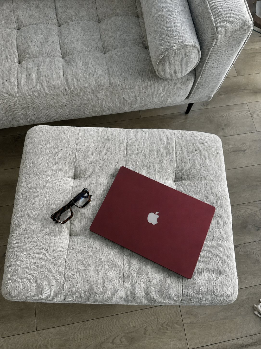 A closed laptop and glasses at rest, the quiet end of a Denver website project